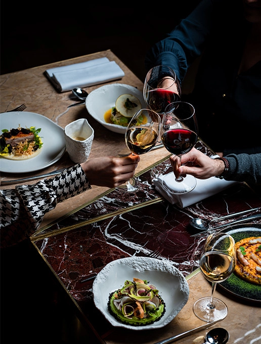 A group of guests celebrating a departure with a gourmet dinner at Dans le Noir ? restaurant